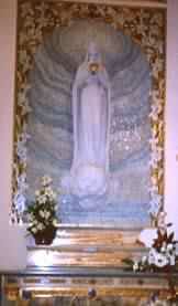 Statue of Our Lady of the Globe above casket with incorrupt body of St Catherine Labouré (Donal Foley)
